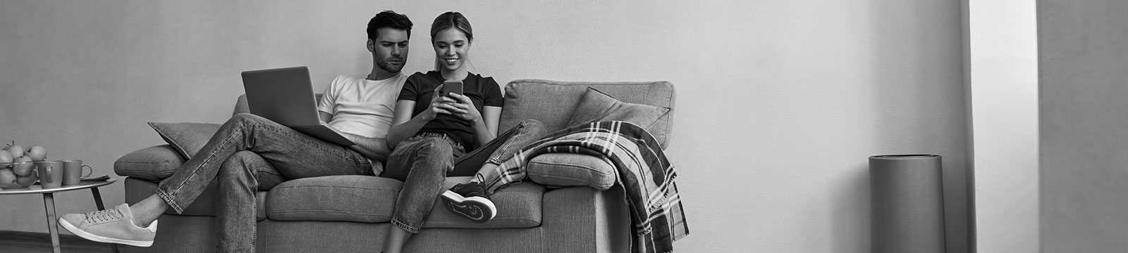 young couple sitting on couch