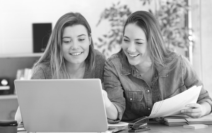 two people working on computer